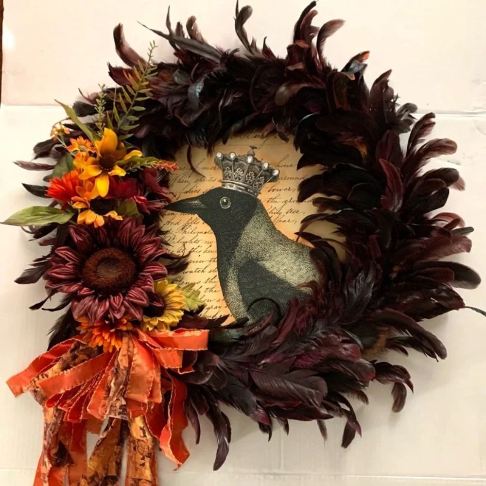 Dark red and black feather wreath with fall floral and a crowned crow center